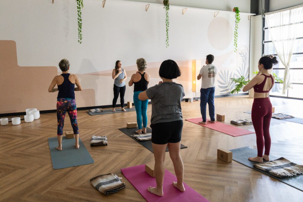 Christina guiding students in tadasana