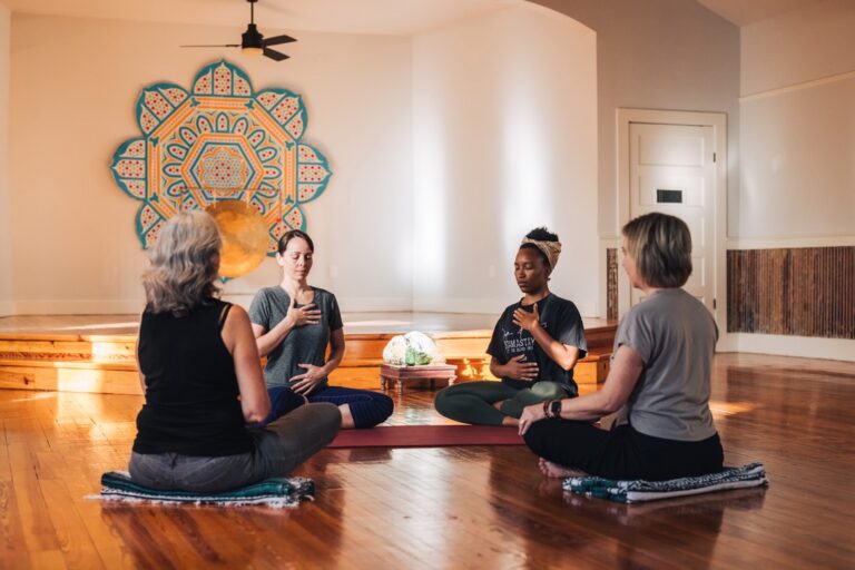 circle of seated yogis breathing